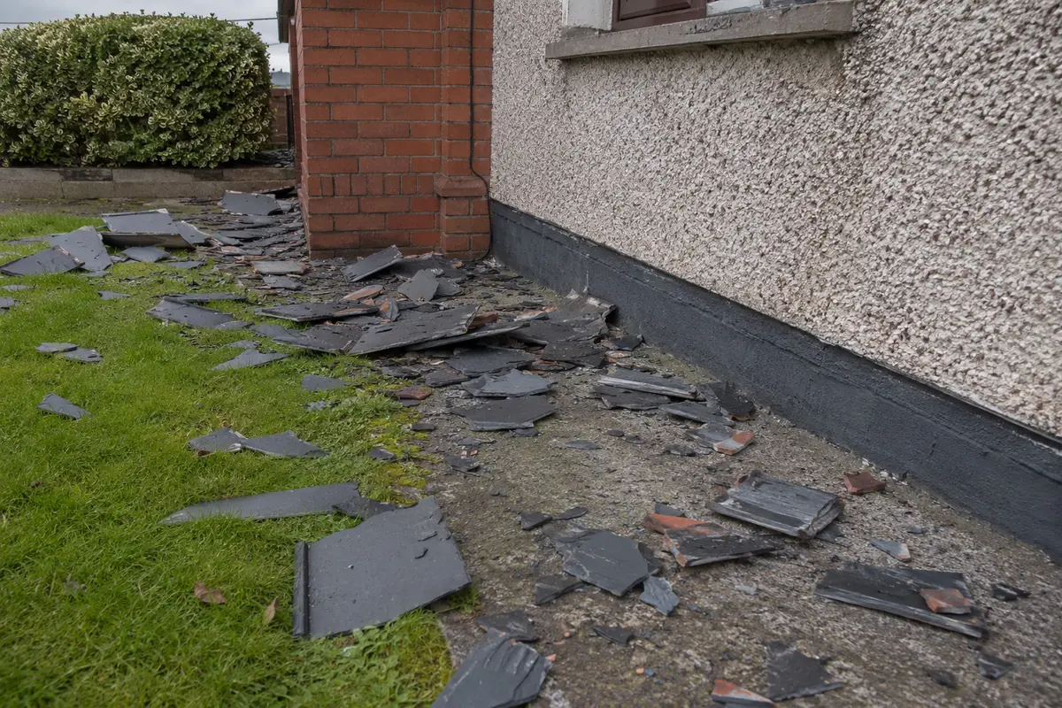 Storm-lifted slates on a Dublin roof
